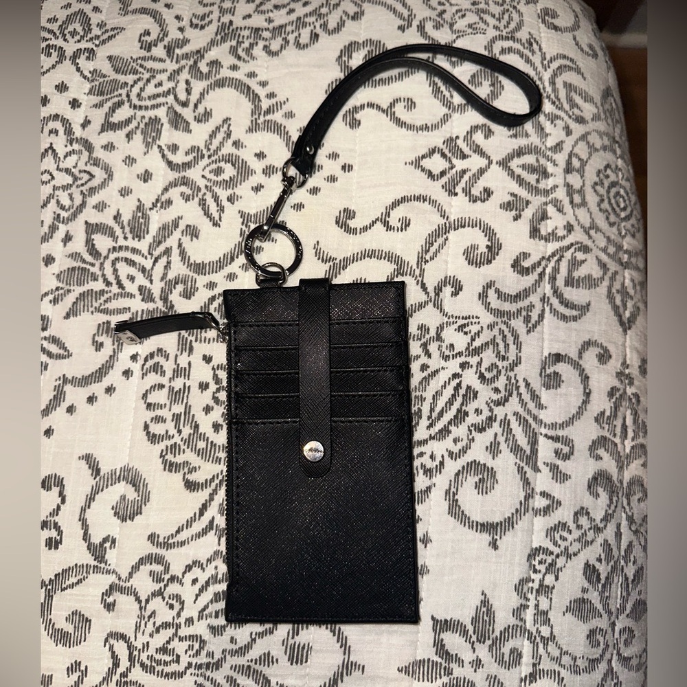 Calvin Klein card holder wristlet 10 pockets total. Front is the same as back